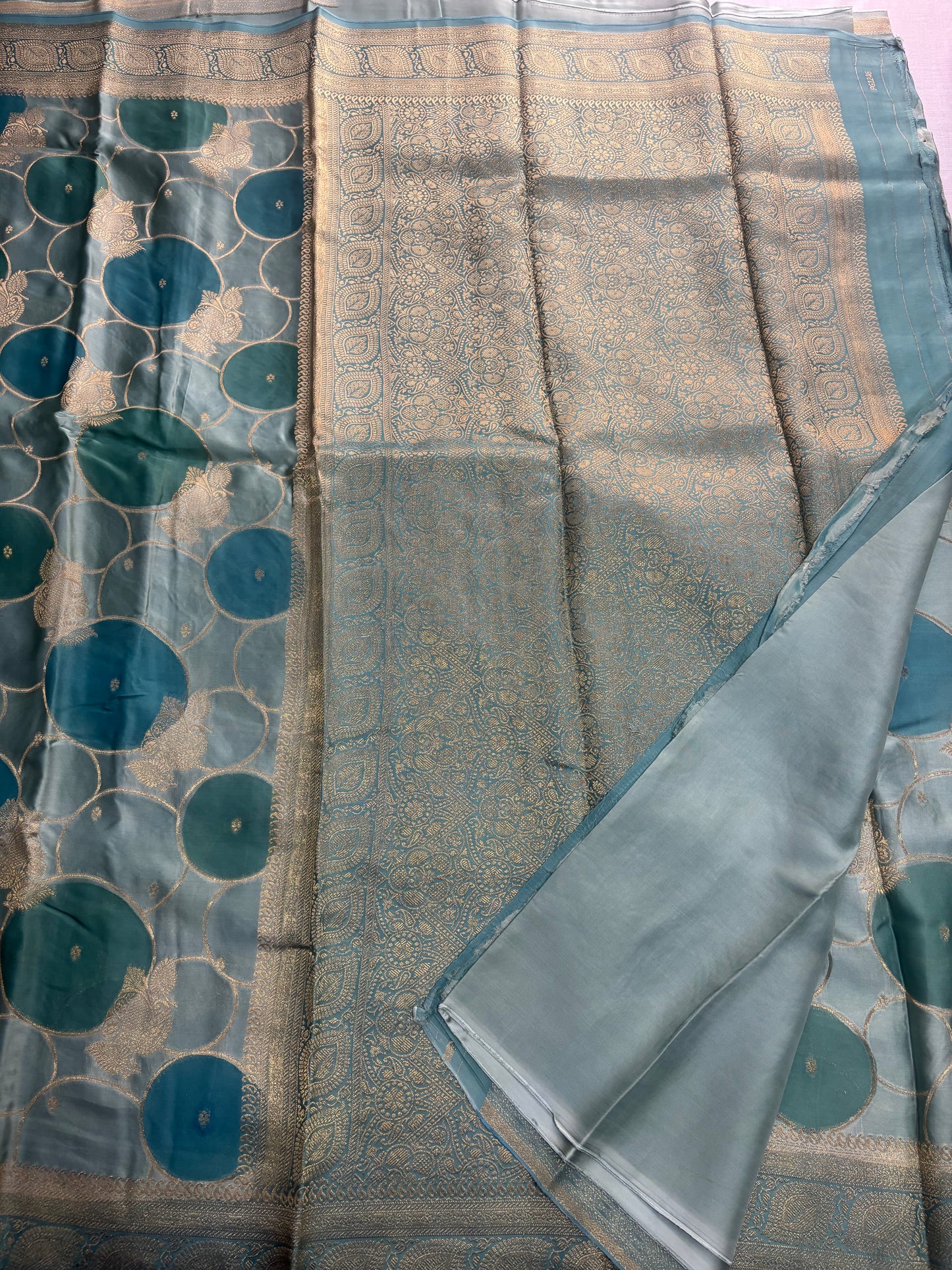 Sea Green Banarasi Russian Silk Saree with Gold Circular shaped Rangkat weaving with Golden Leaf Border- Designer Party Wear