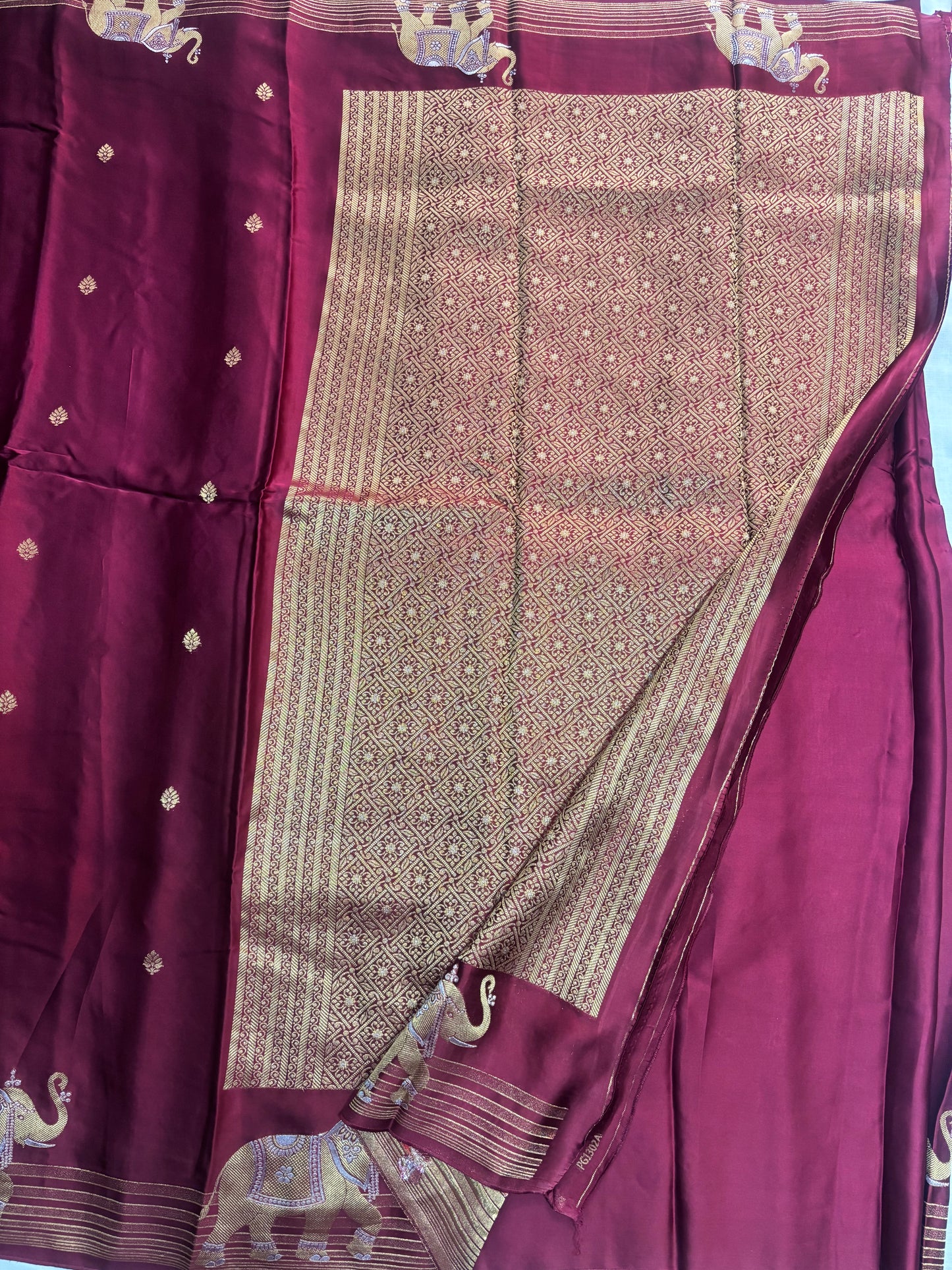 Magenta Banarasi Russian Silk Saree with Small Butta and Golden Elephant Figure Motifs - Designer Party Wear